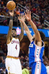 Cavaliers guard Iman Shumpert shoots over Philadelphia rookie forward Jahlil Okafor in the Cavs' 108-86 victory at Quicken Loans Arena.